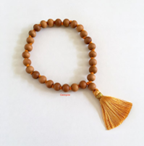 STD/BL/6 - Mala Sandalwood Bead Elastic Bracelet - a) Orange Tassel OR b) Red Tassel