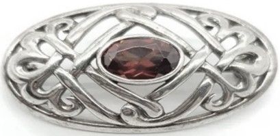 BRO/S/4 - Celtic Design Oval 925 Brooch with Garnet Centre.