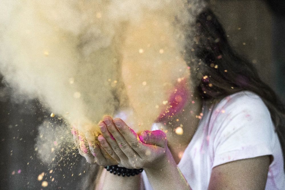 woman-in-white-cap-sleeved-shirt-blowing-dust-632722