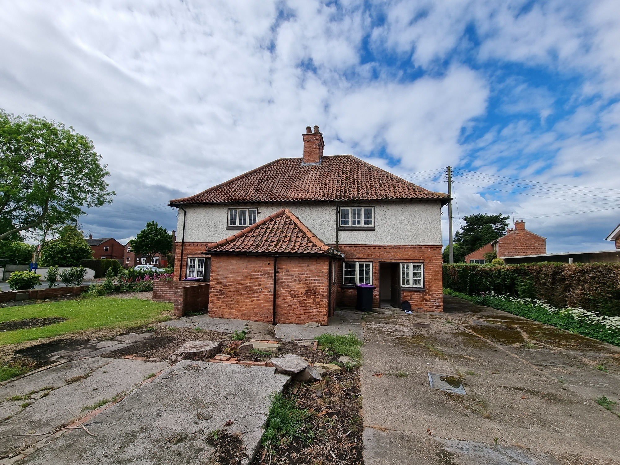 Heritage façade of Bradshaw Transport cottages preserved during planning approval