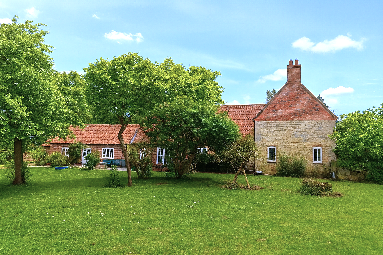 Rural tourism development featuring renovated farmhouse and modernised outbuildings