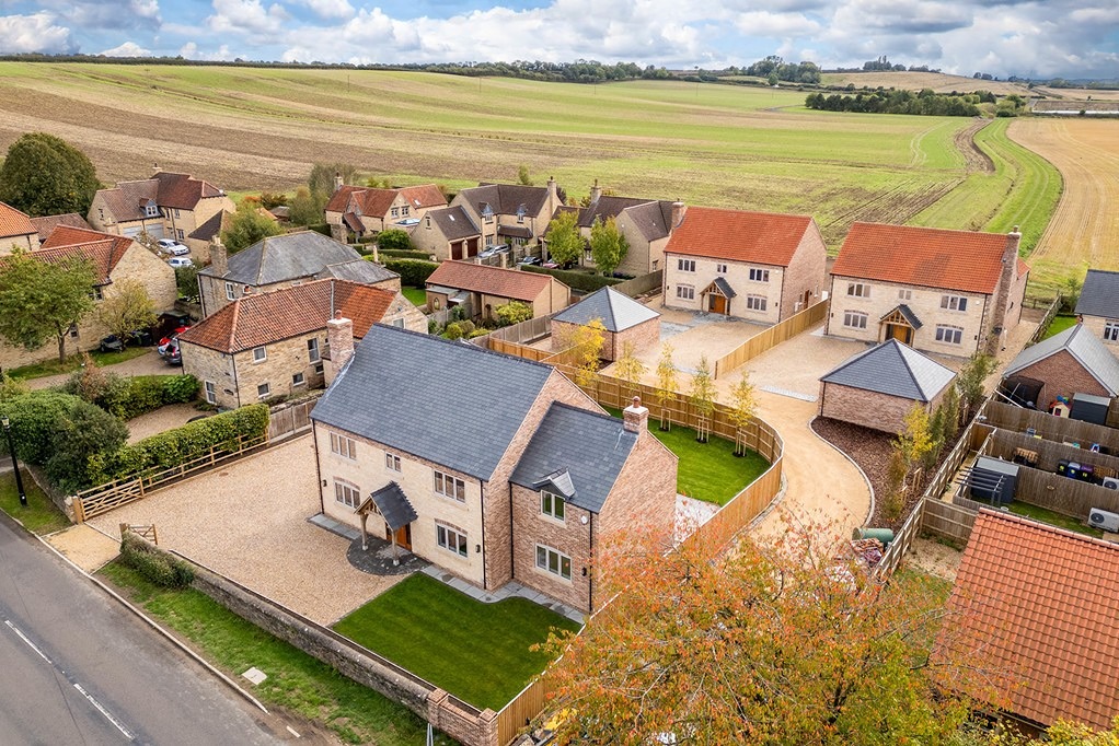 An aerial view showing how the 3 new homes would look.  As shown they are designed to fit in with the surrounding area and use high quality materials that reflect the character of Scampton. 