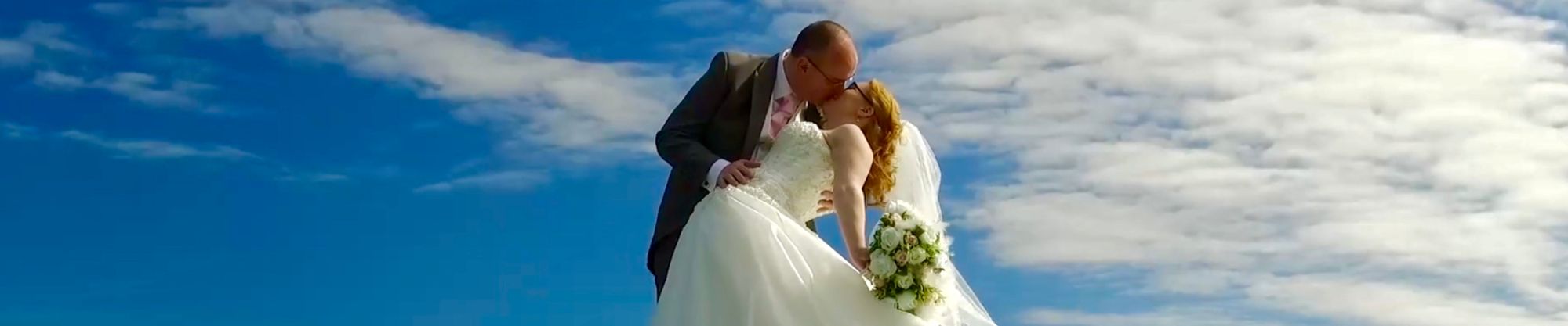 Bride and Groom on top of a hill