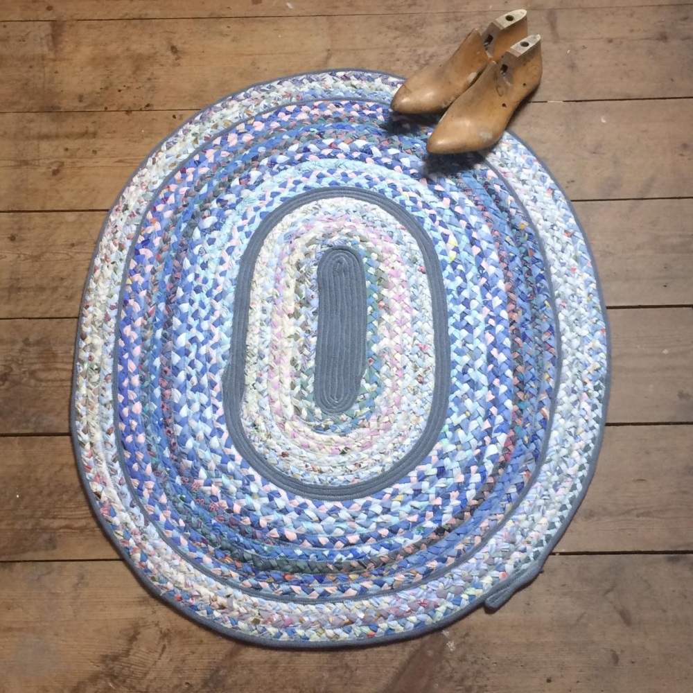 Pale blue and grey oval recycled fabric rug