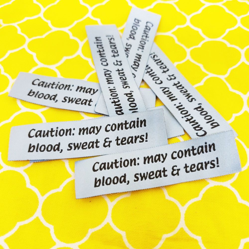 Sew in labels - Caution may contain blood sweat and tears!
