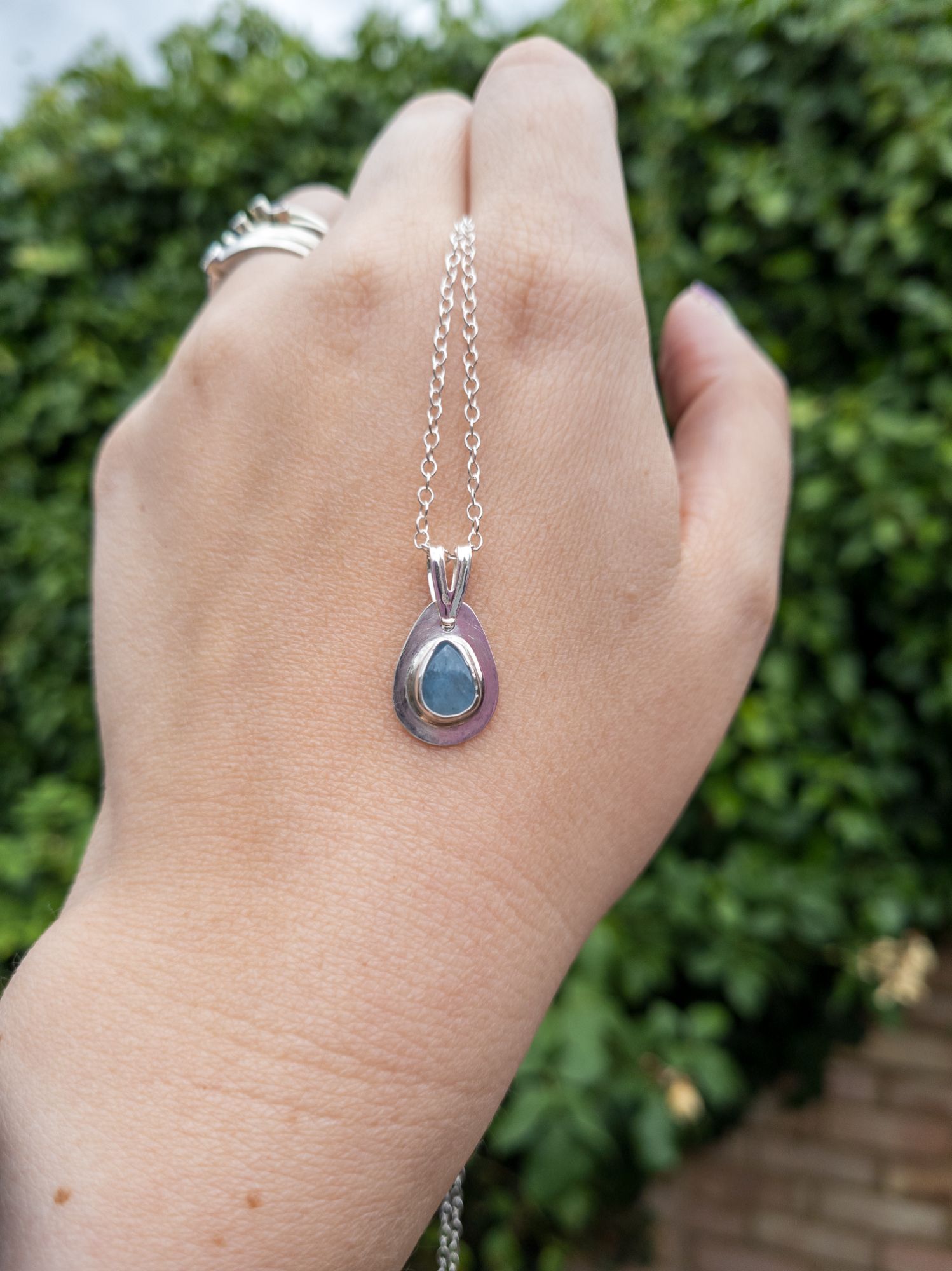 A beautiful pear shaped aqua blue quartz gemstone set in a handmade sterling silver bezel,  a perfect little gem of colour to add to yur collection