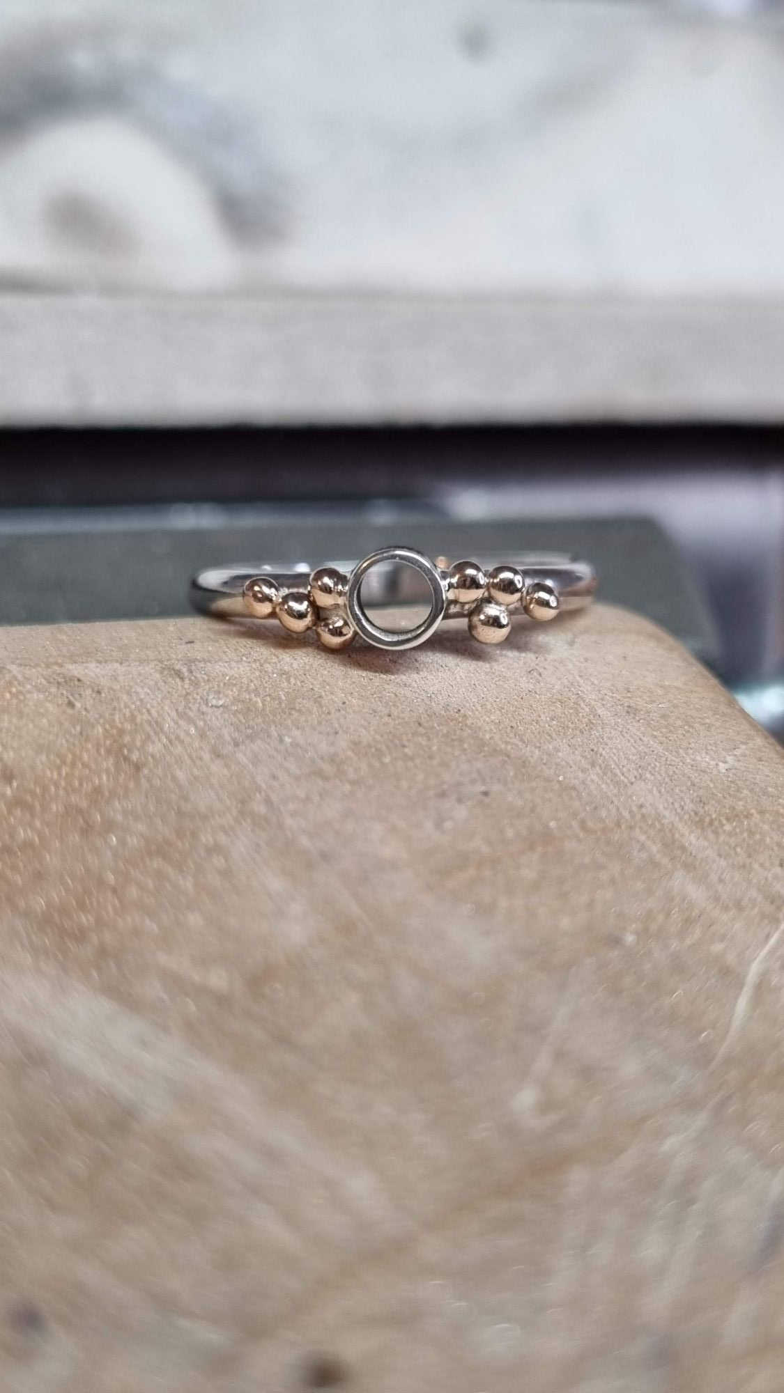 Work in progress of a silver and gold granulation ring 