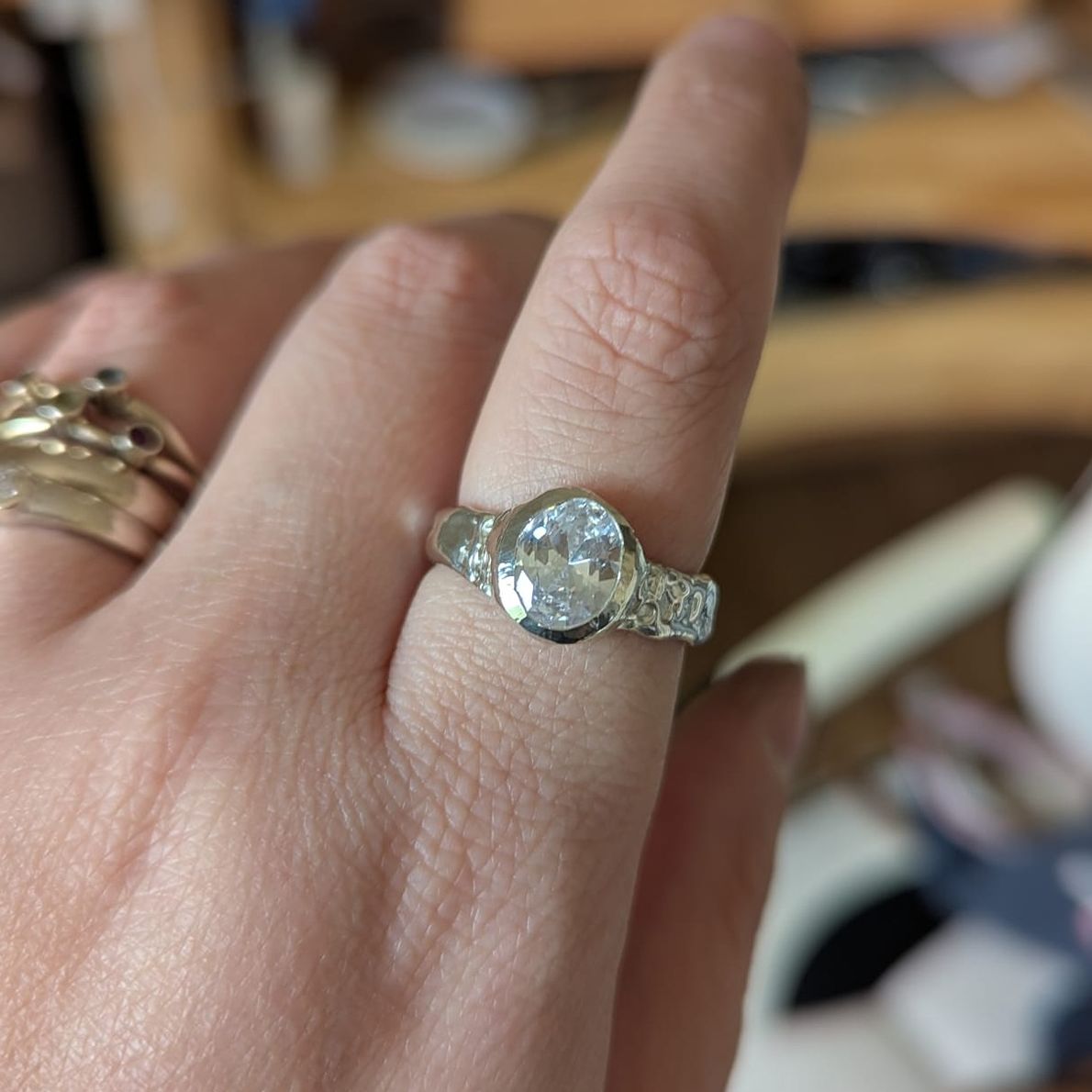 The finished ring in sterling silver in the studio