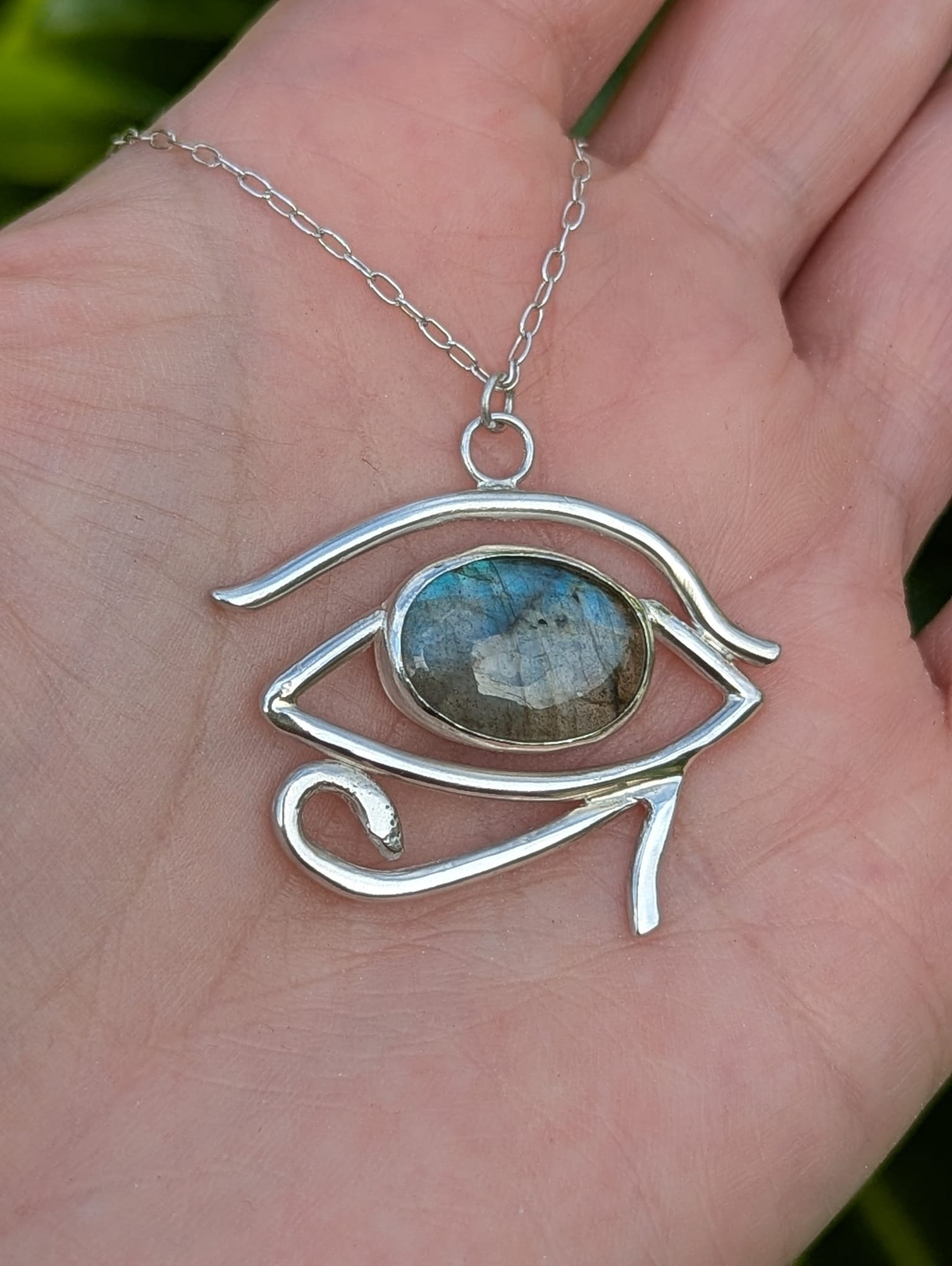 Eye of Horus Necklace in a hand