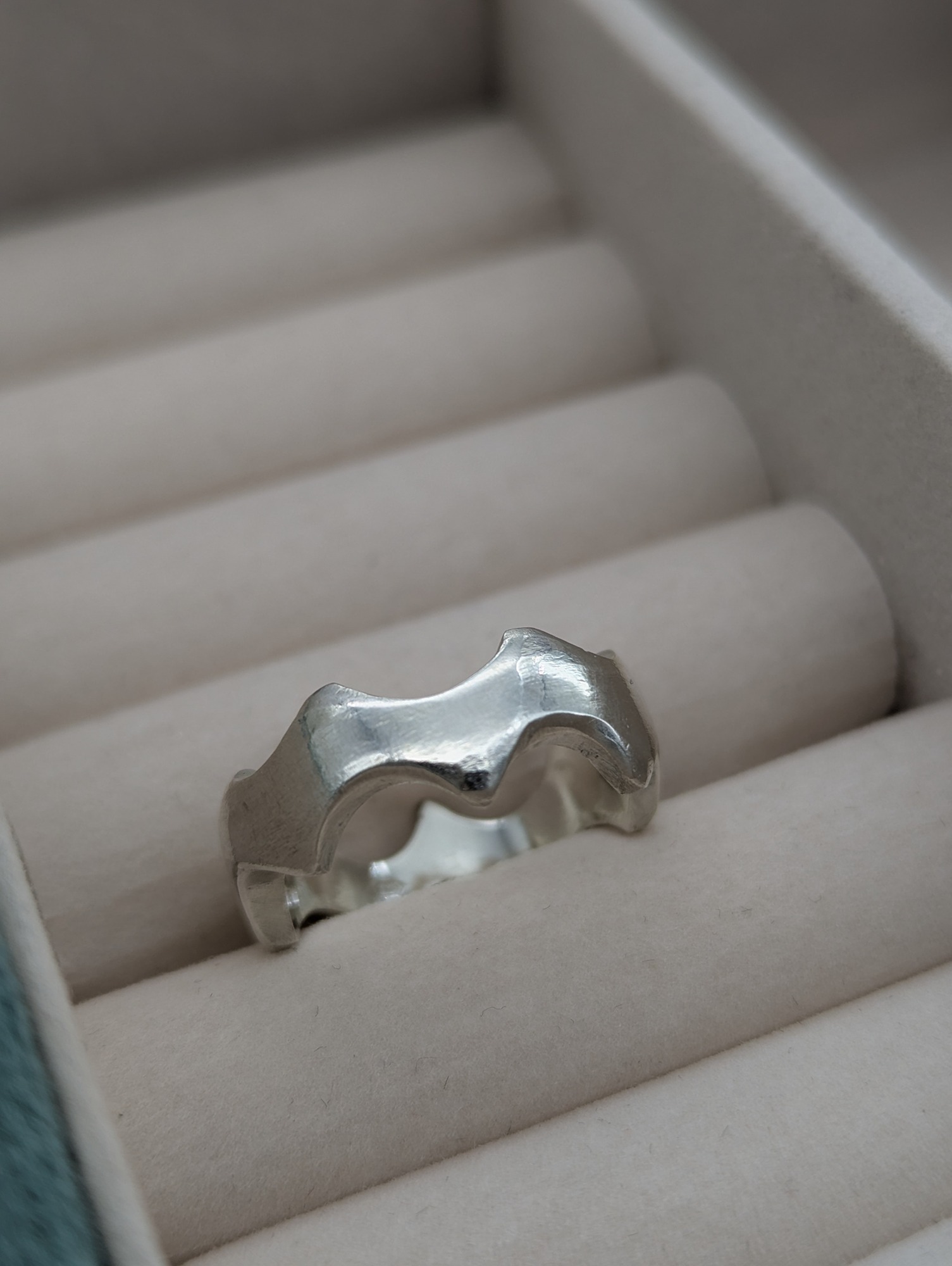 Abstract sterling silver crown ring in a jewellery box