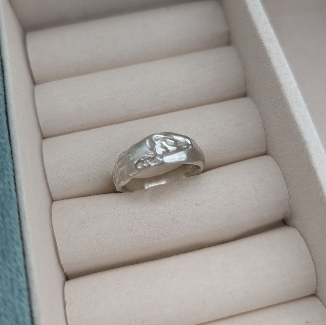 Sterling silver molten design ring in a jewellery box