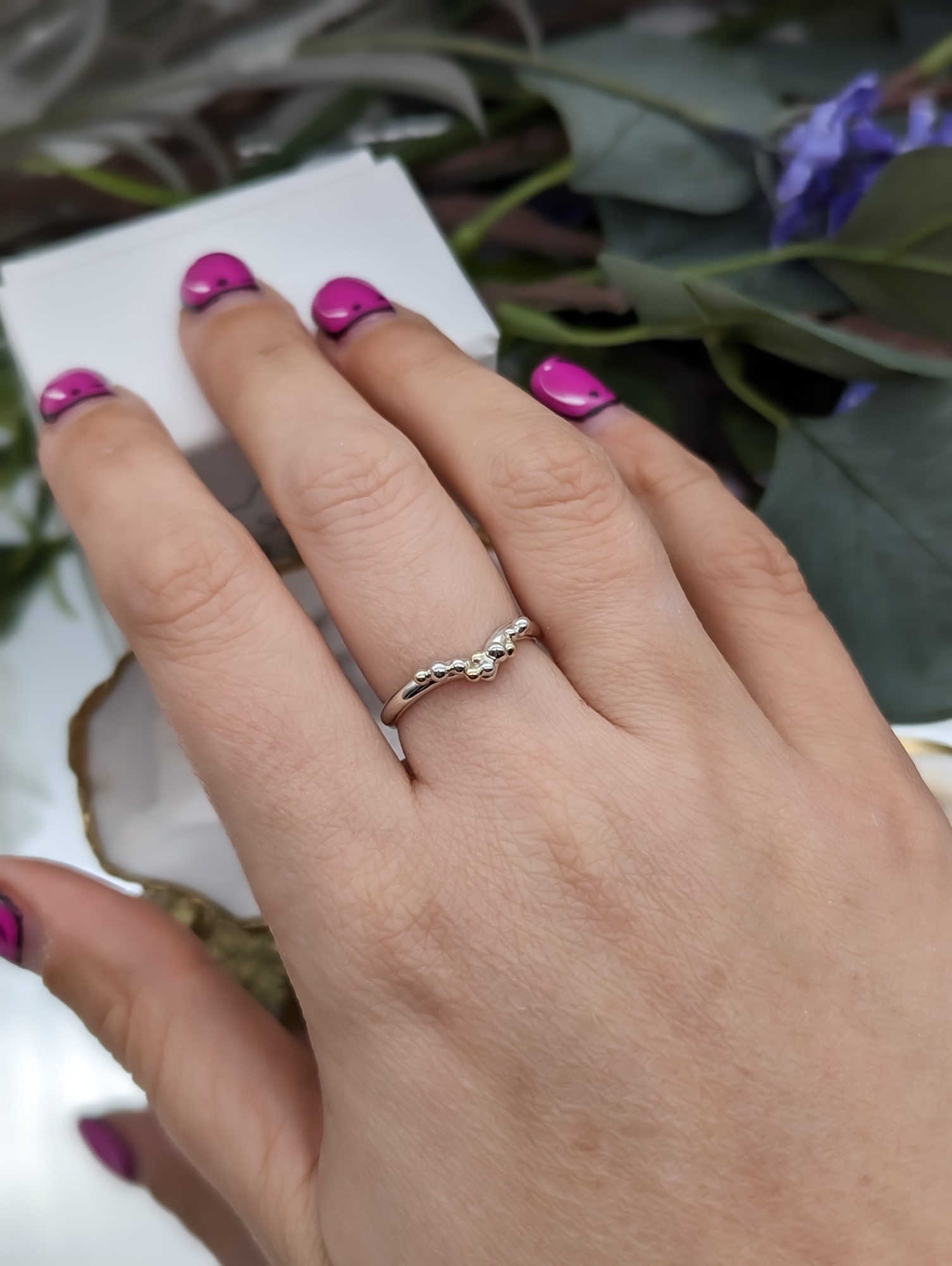 Silver & gold granulation wishbone ring modelled on a hand