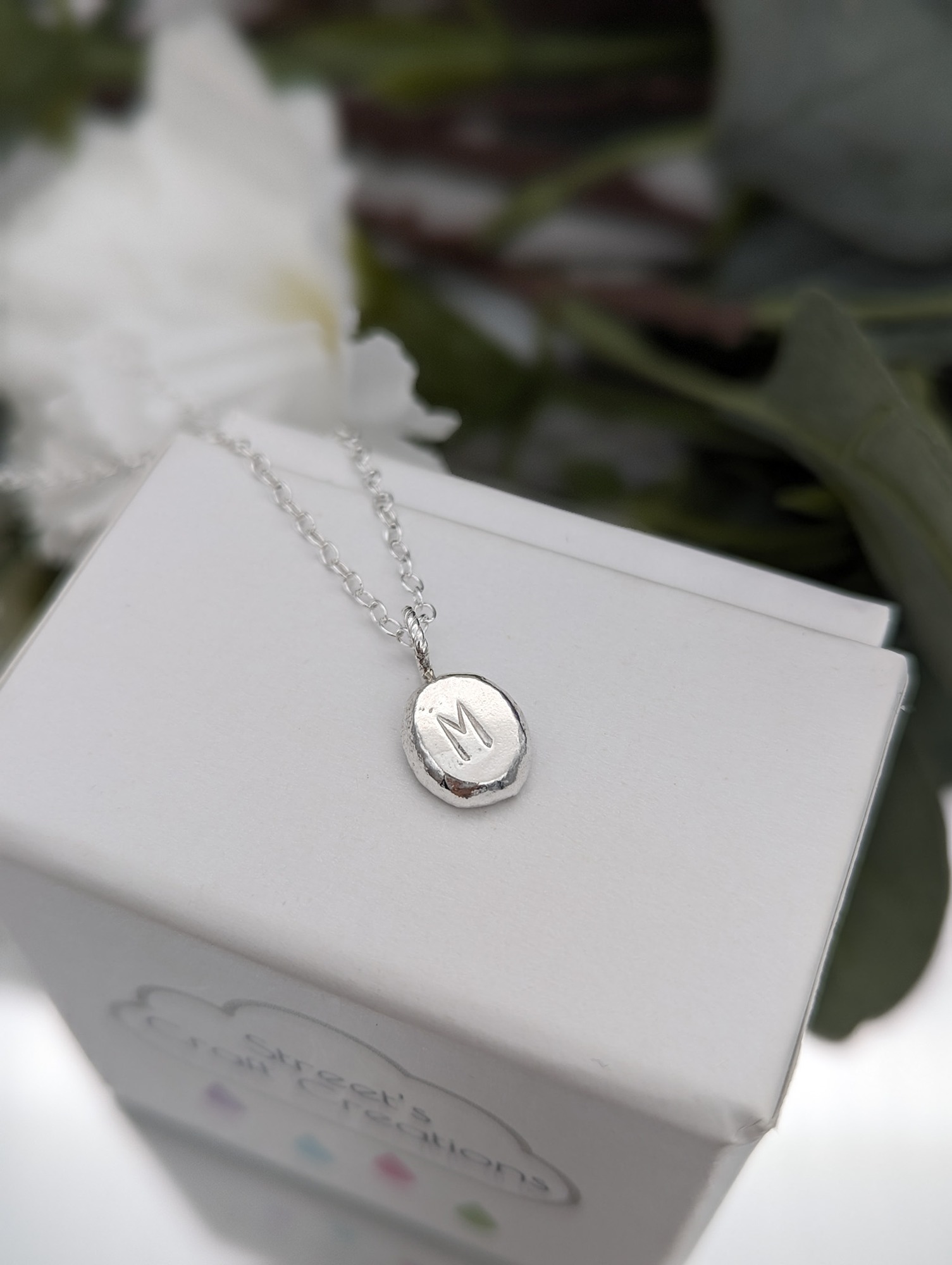 Initial pebble necklace with M initial