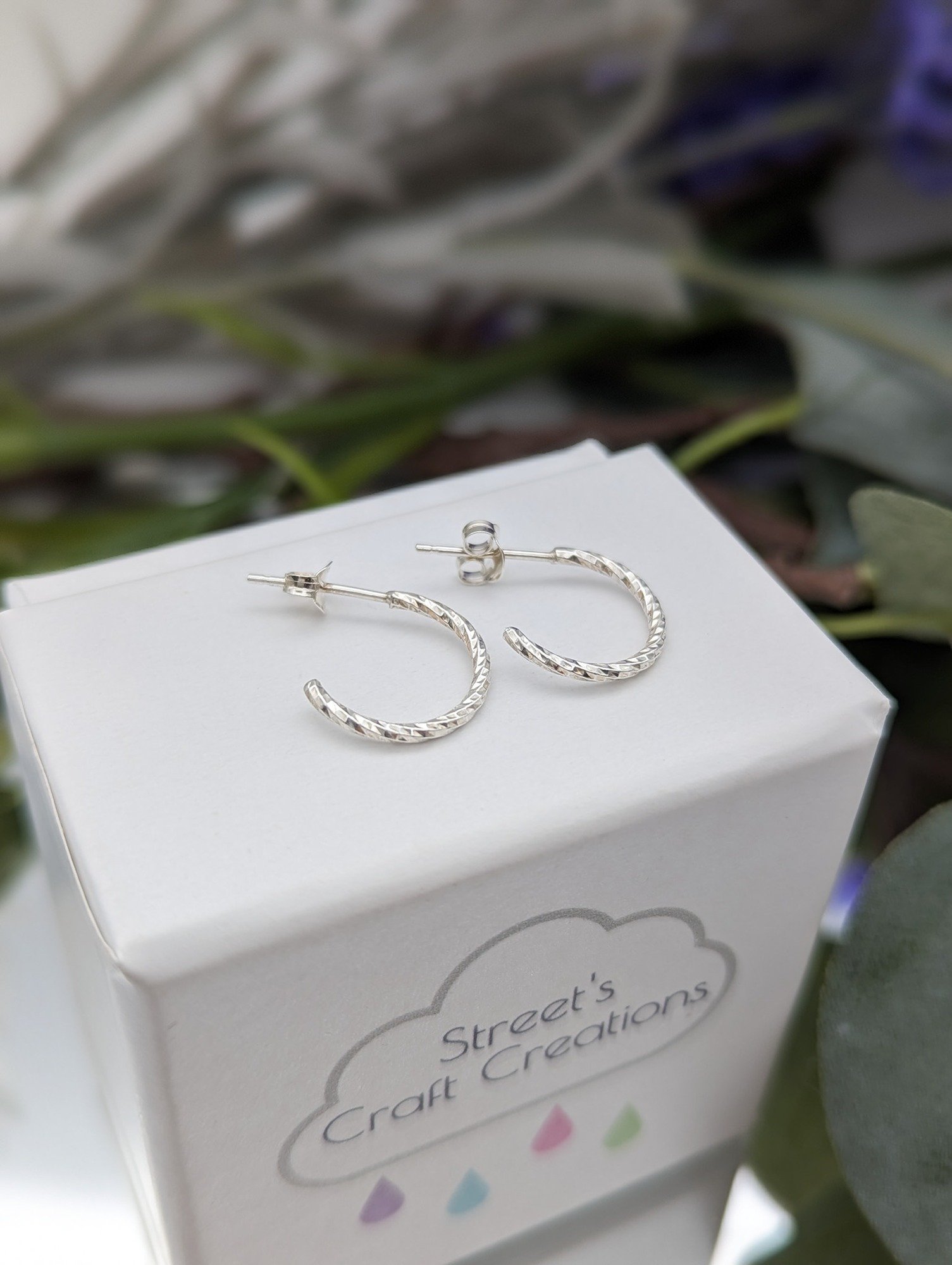 Diamond twist half hoops earrings