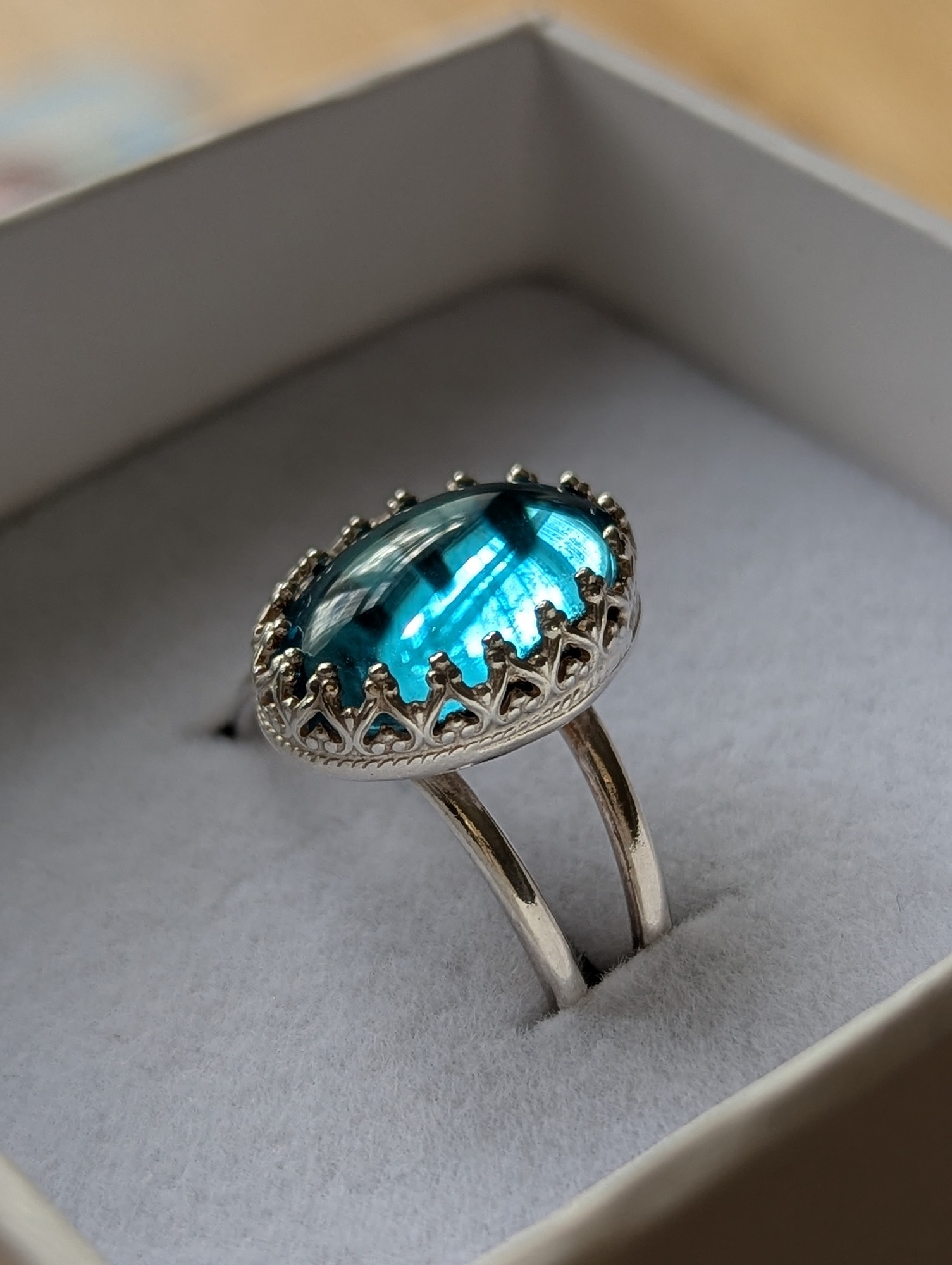 Aqua glass cabochon and silver ornate ring