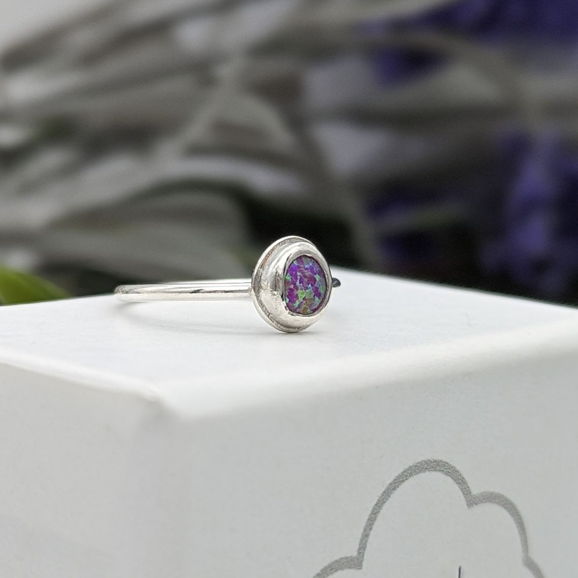 Side profile of pink created Opal gemstone ring