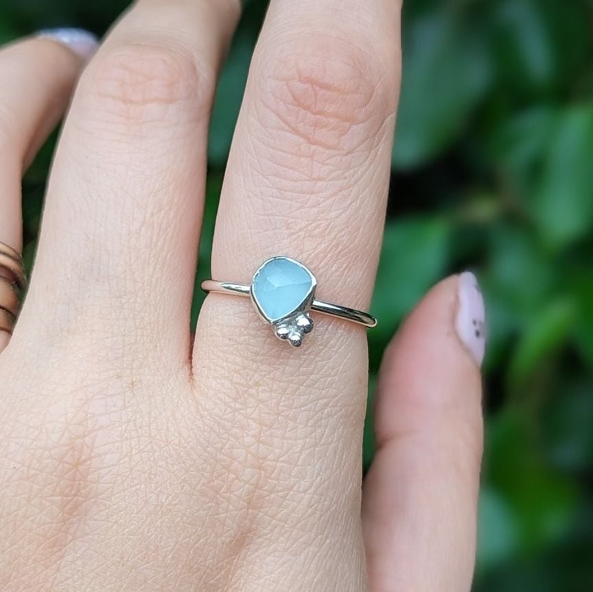 Silver Aquamarine ring being worn on a finger