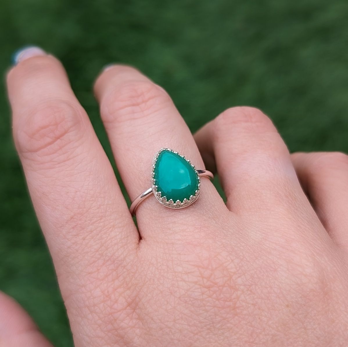 Chrysoprase silver ring being modelled on a hand
