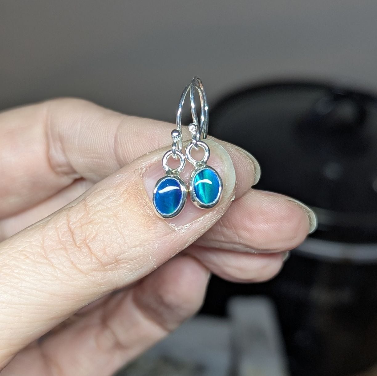 Showing the colour play of green in the Aurora Opals