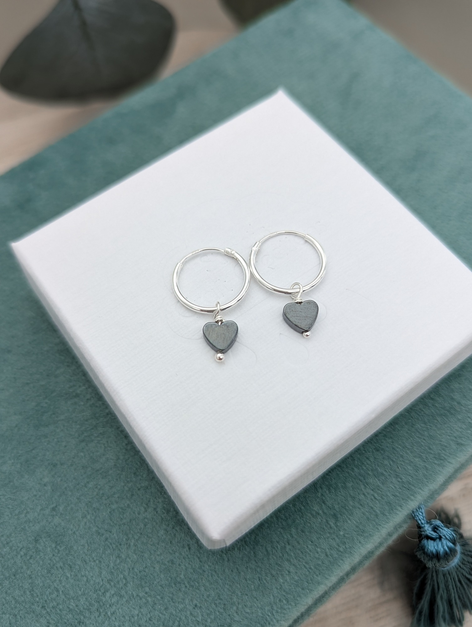Silver hoops with hematite gemstone hearts