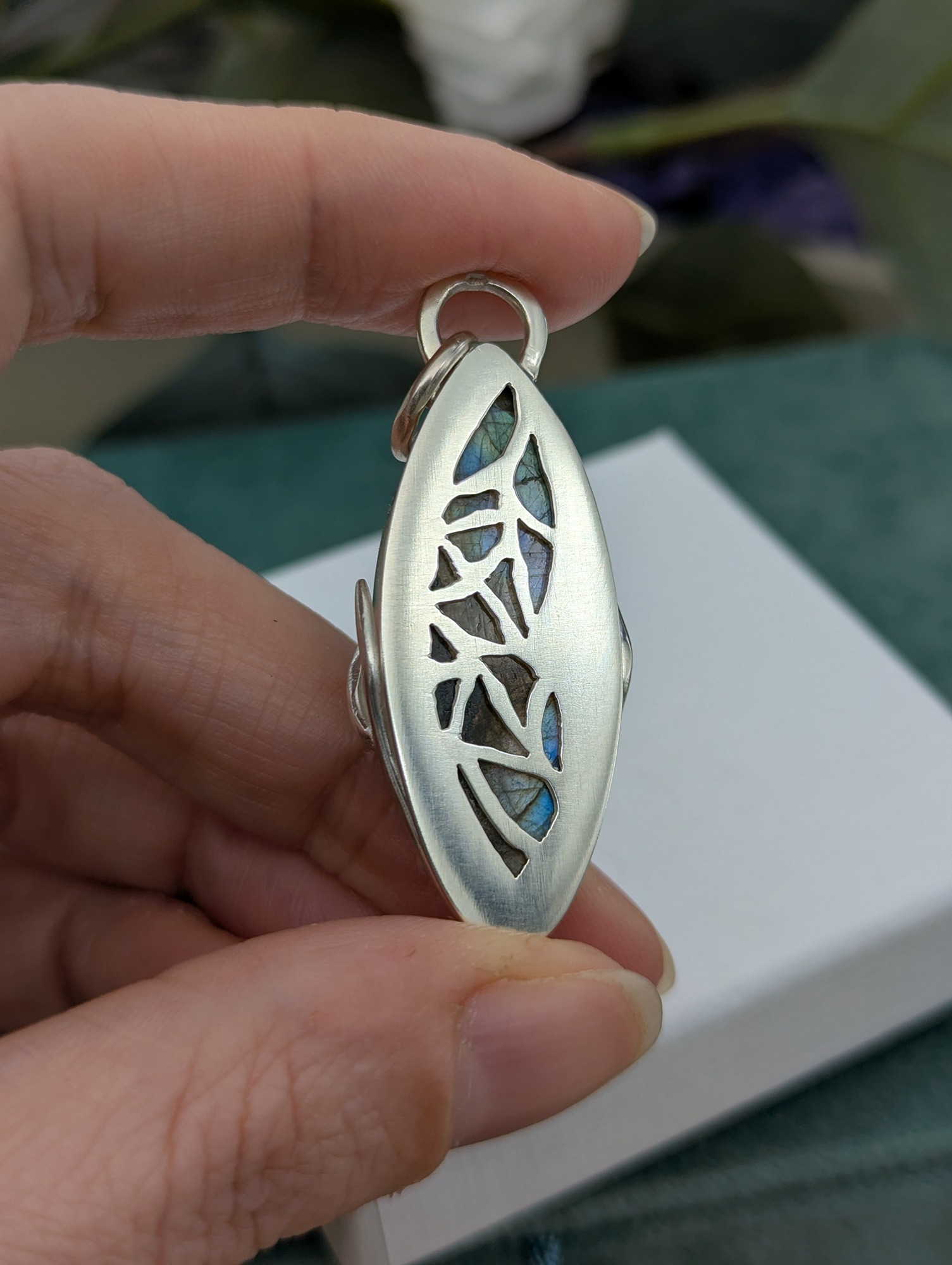 The reverse of the pendant showing the beautiful butterfly cut out detail