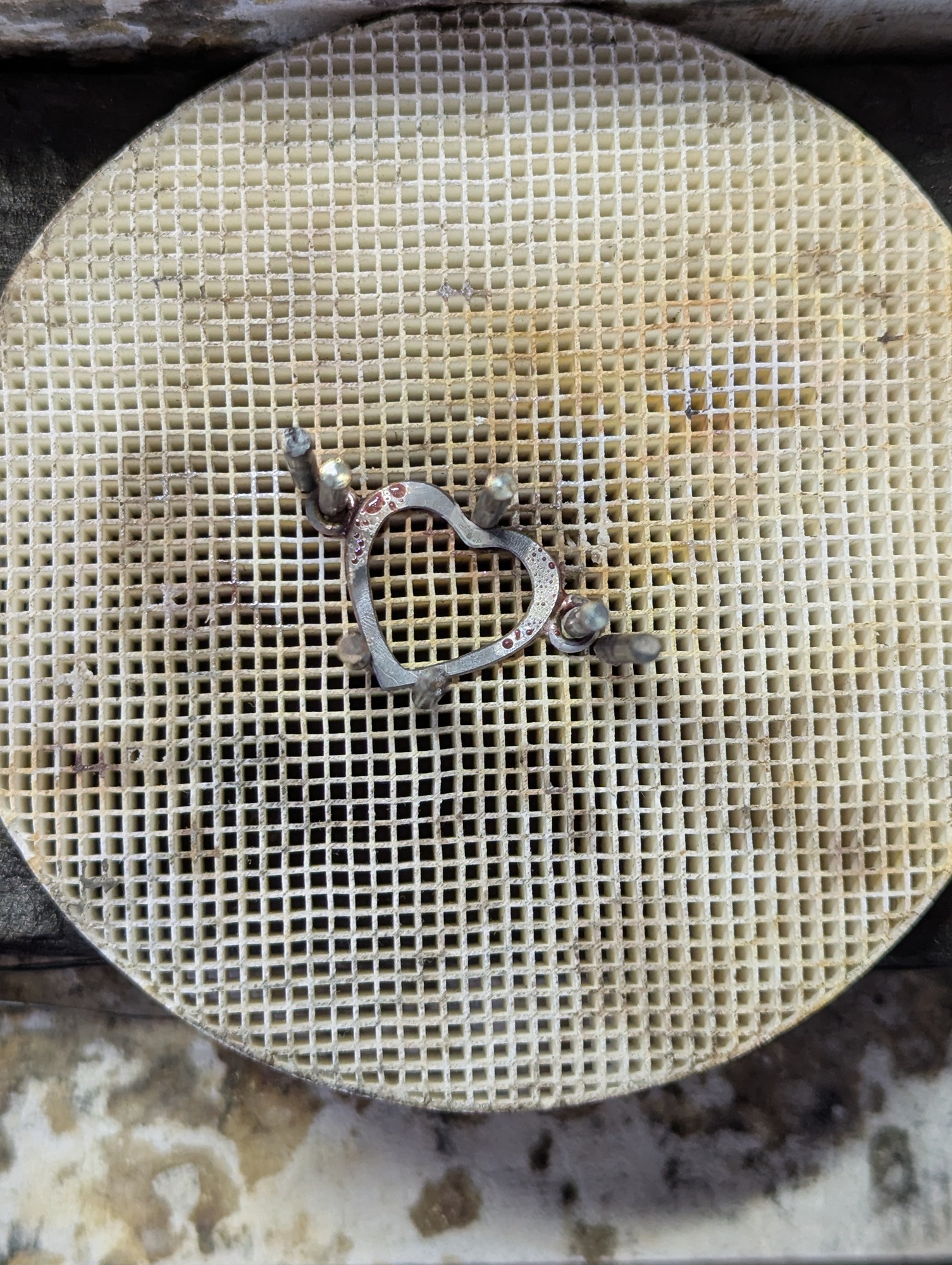 soldering work on the heart bracelet