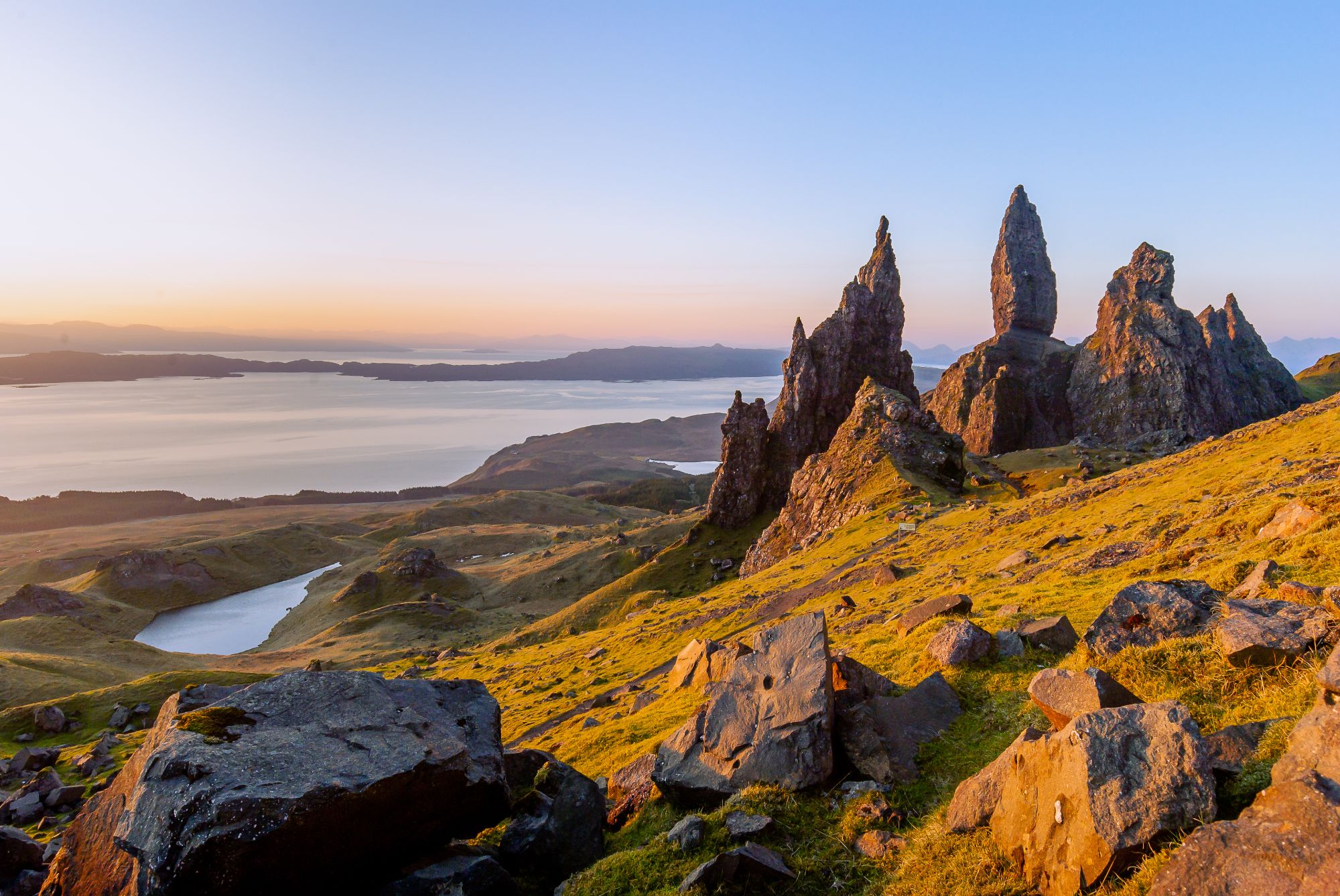 The Old Man of Storr is photographed in the morning golden hour.