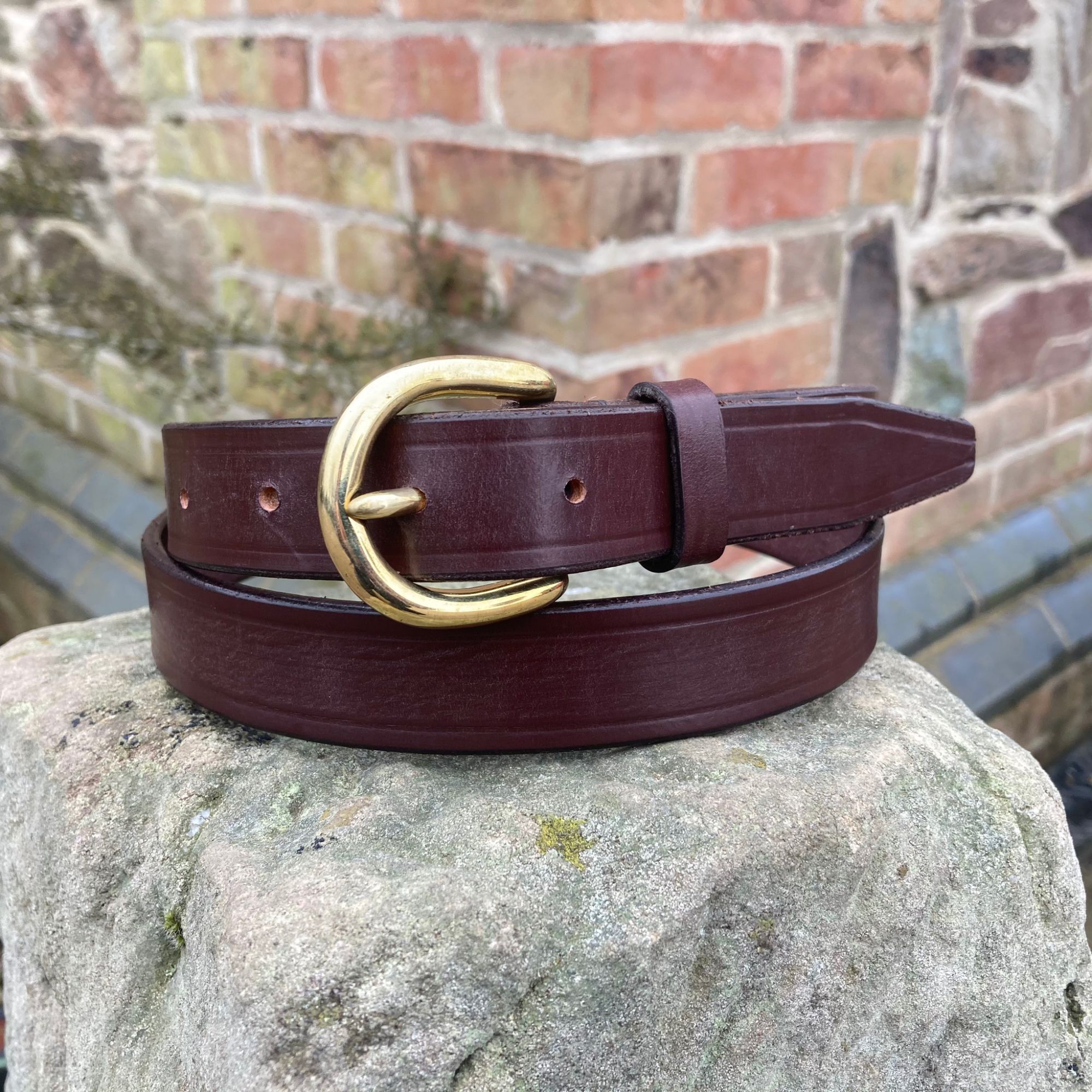 red leather belt with stirrup buckle
