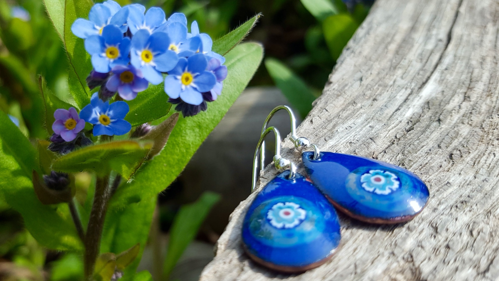 Bright blue enamel forget-me-not flower silver stud earrings handmade in West Yorkshire