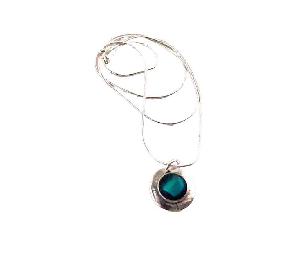 Mini pendant containing an aqua coloured cabochon, complete with sterling silver chain