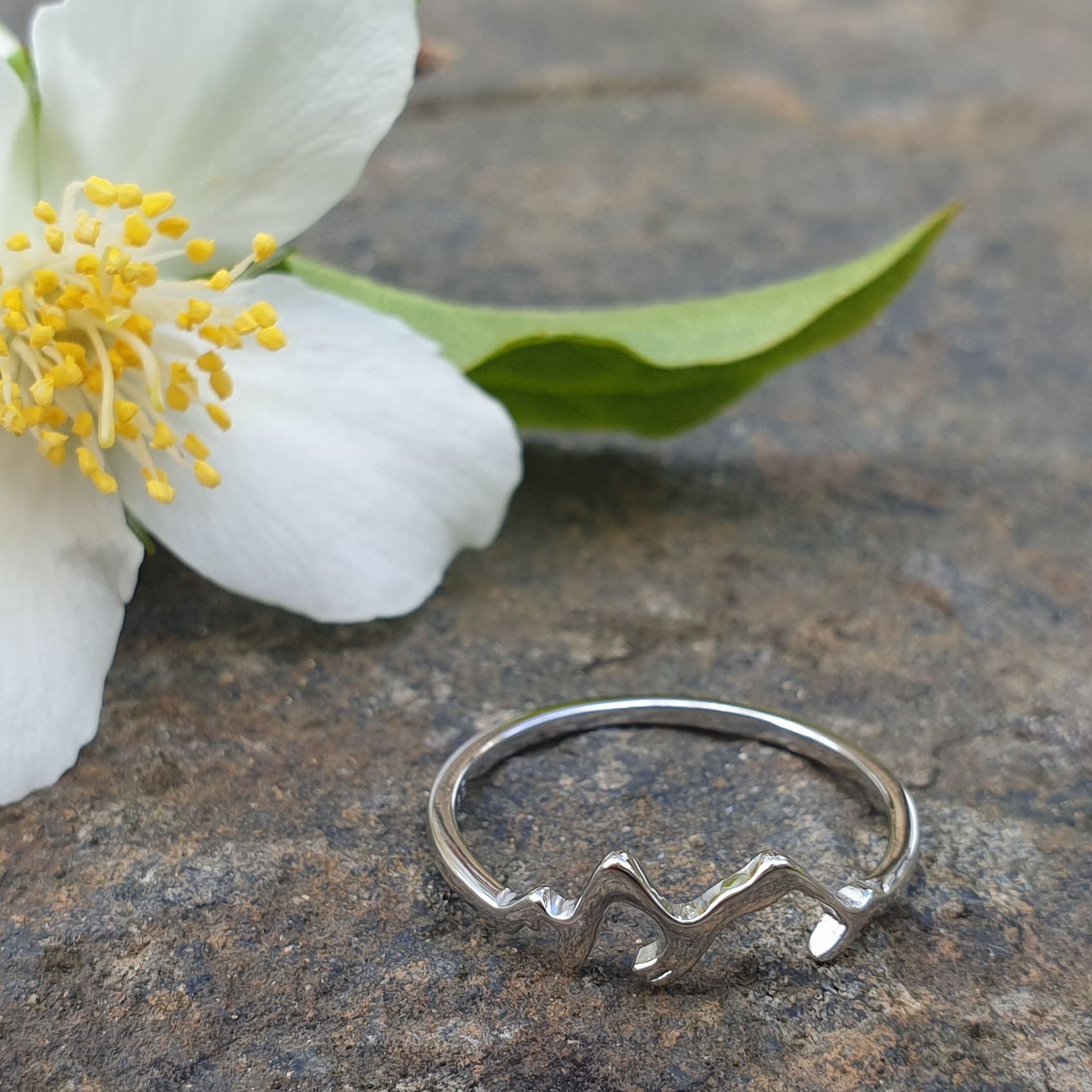 Sterling silver ring featuring the ridges of mountains