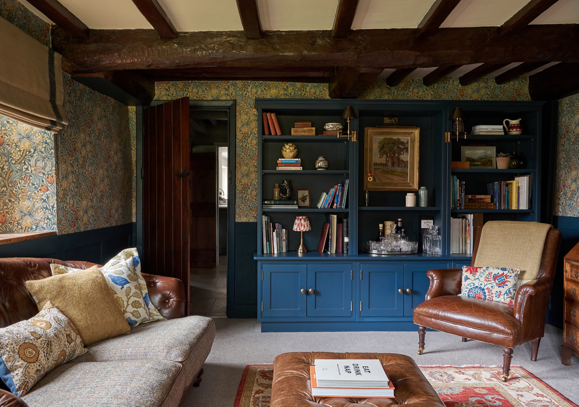 farrow and ball Hague blue  cabinetry with William Morris wallpaper. Pooky lighting and  art ones  vintage artwork