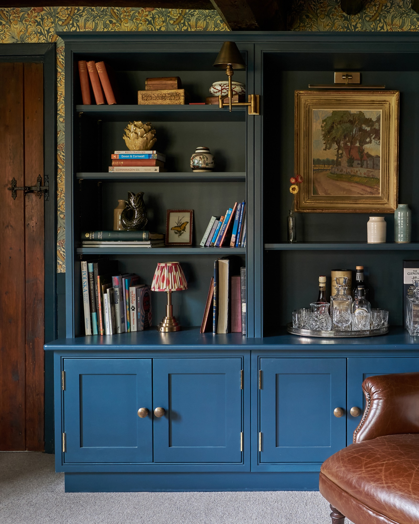 farrow and ball Hague blue  cabinetry with William Morris wallpaper. Pooky lighting and  art ones  vintage artwork