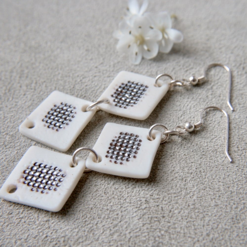White textured monochromatic discs - dangle earrings