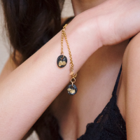 Gold bracelet with charms and moon