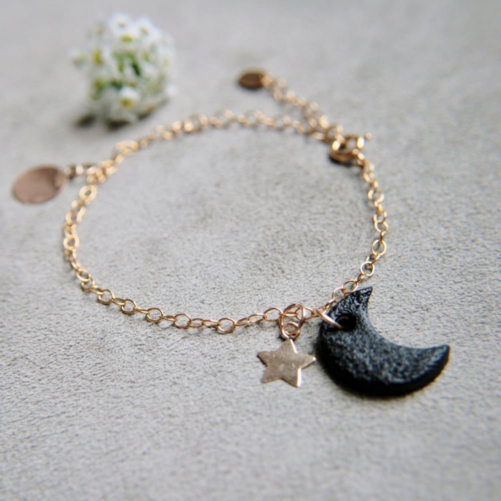 Gold bracelet with smooth discs & moon