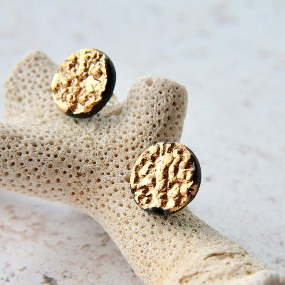 Stud earrings with gold.