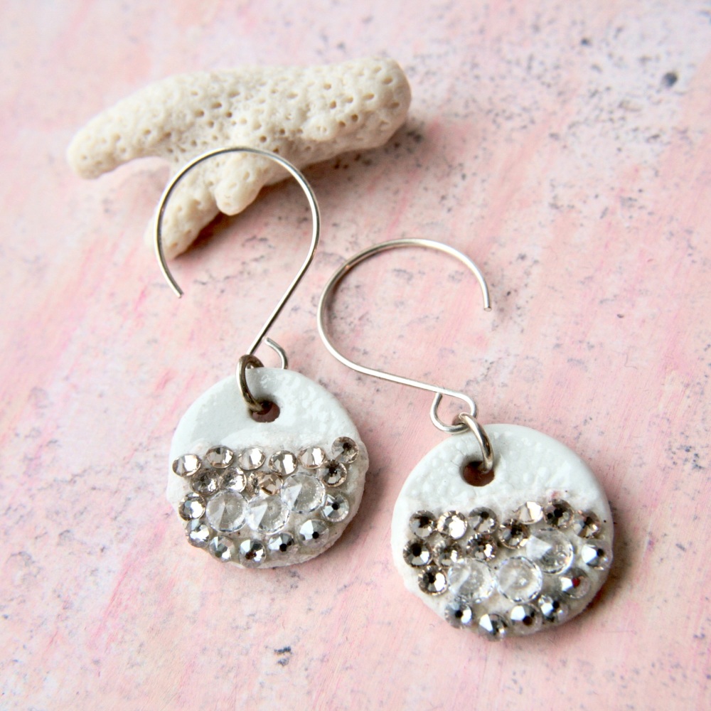Porcelain earrings adorned with crystals.