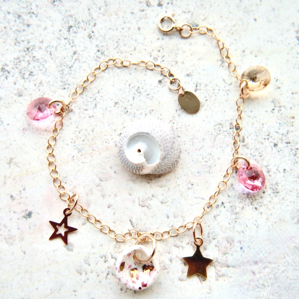 14k gold charm bracelet with handmade porcelain seashell and light pink crystals.