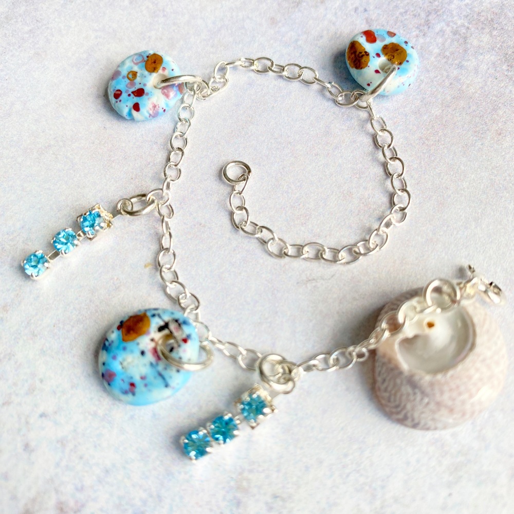 Sterling silver bracelet with blue porcelain charms