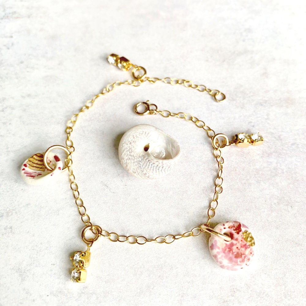 14k gold charm bracelet with handmade porcelain seashell,  light pink.