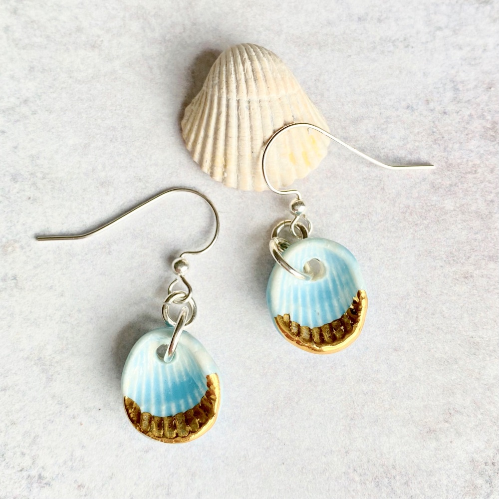Porcelain seashells, drop blue earrings with gold.