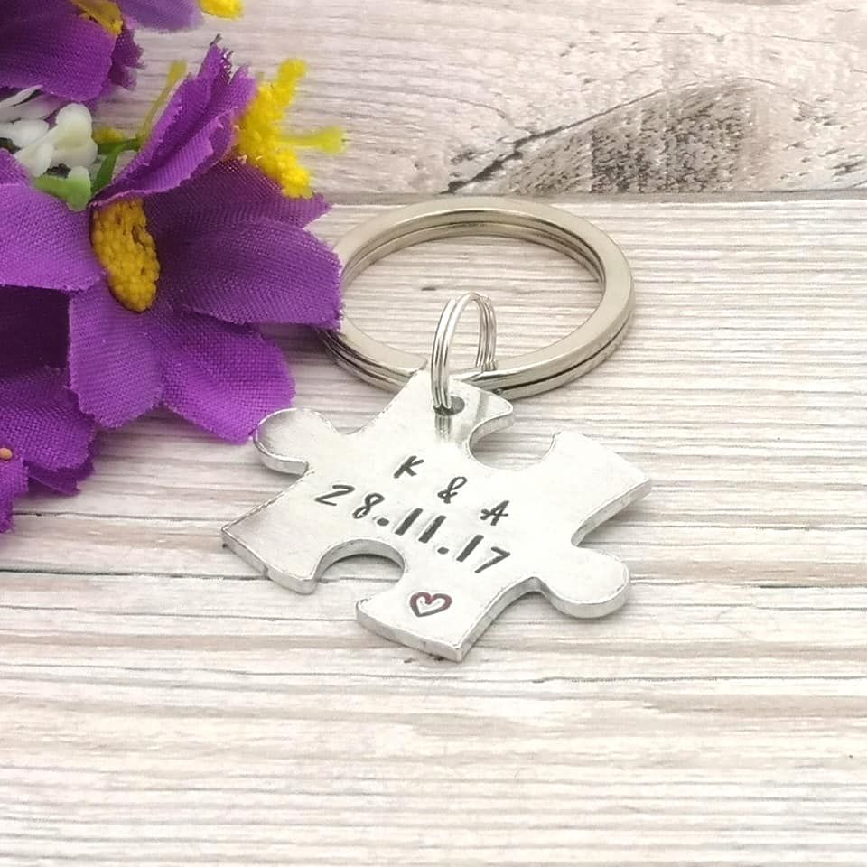 Metal jigsaw piece shaped keyring personalised with two initials & date