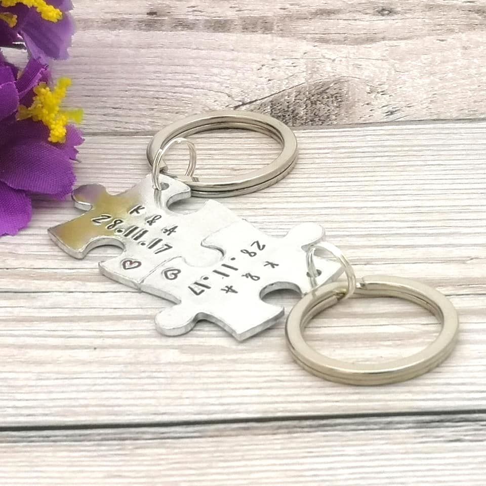 Metal jigsaw piece shaped keyring pair personalised with 2 initials & date