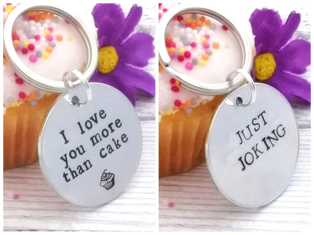 Double sided metal disc keyring. I love you more than cake. Just joking