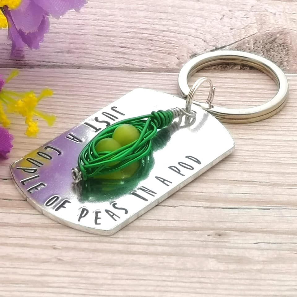 Just a couple of peas in a pod. Metal keyring with wire wrapped pea pod