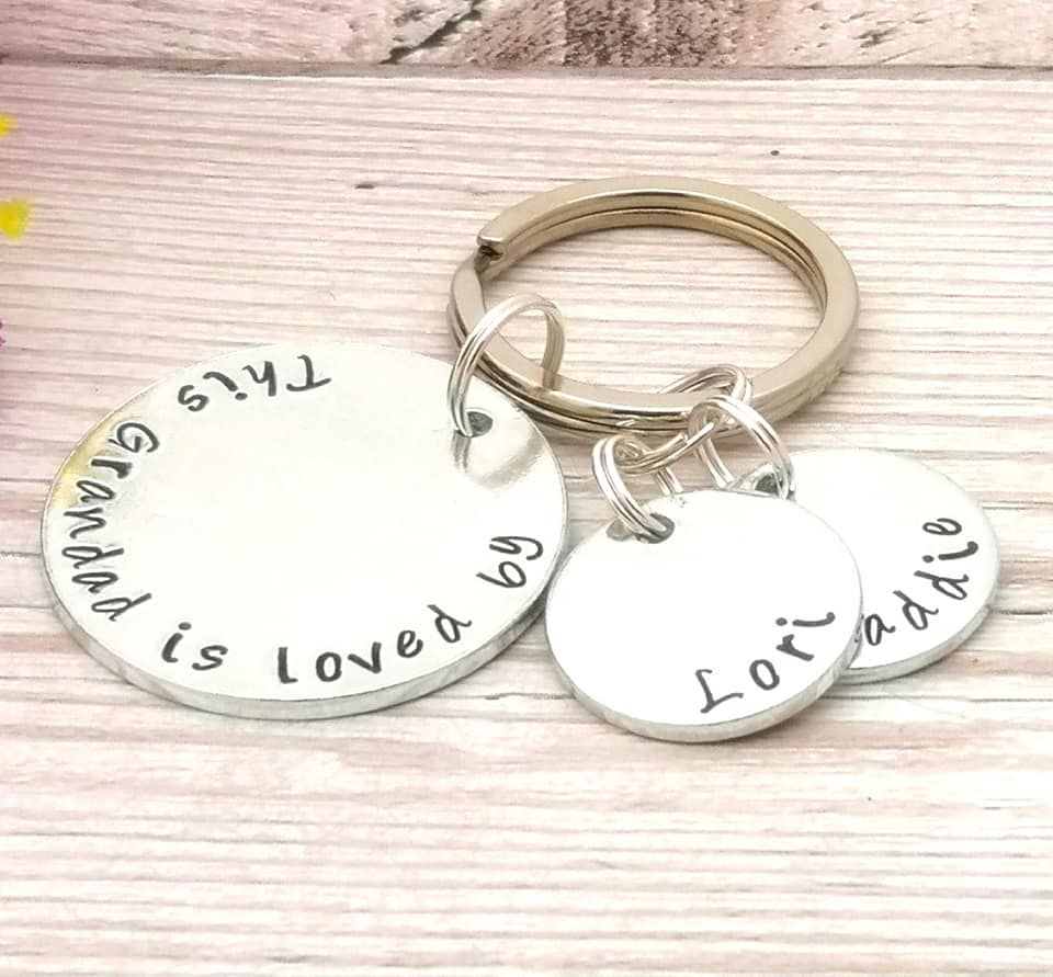 This Grandad is loved by keyring. Multiple personalised name charms