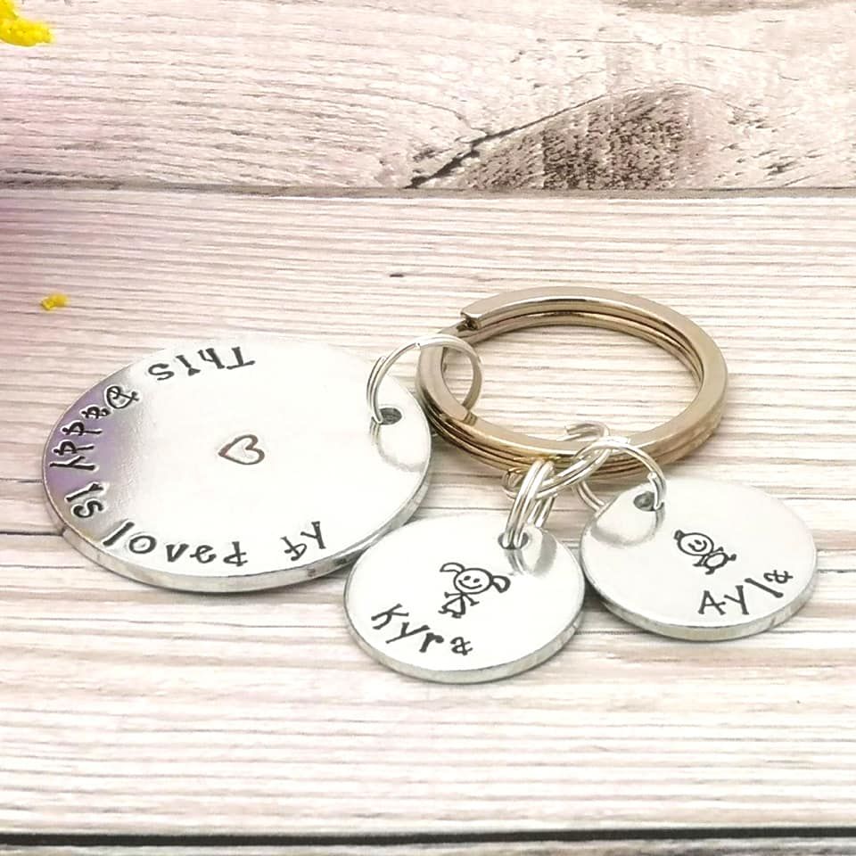 This Daddy is loved by keyring. Multiple charms with names & stick people