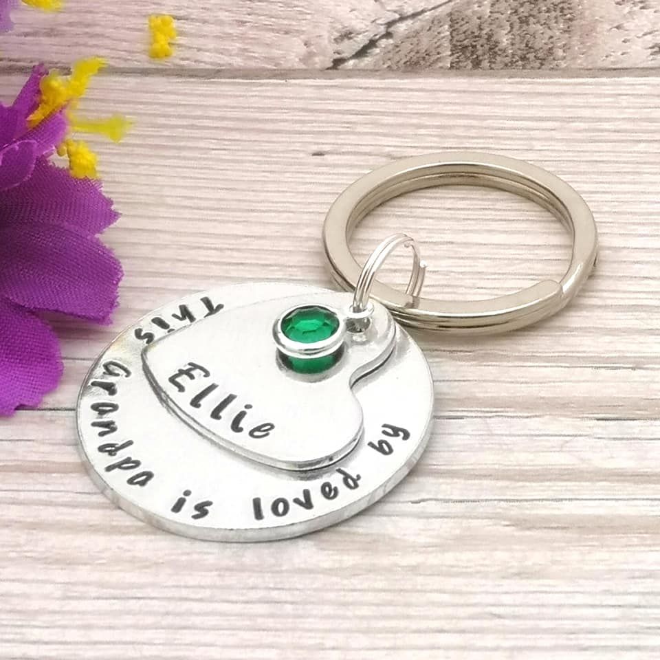 This Grandpa is loved by. Personalised keyring. Heart & circle charm