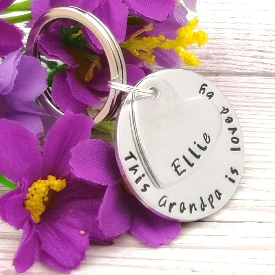 This Grandad is loved by. Personalised keyring. Heart & circle charm